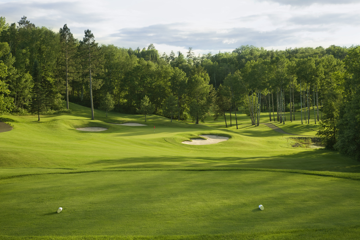 Par 3 hole on golf course in late afternoon sunlight.jpg