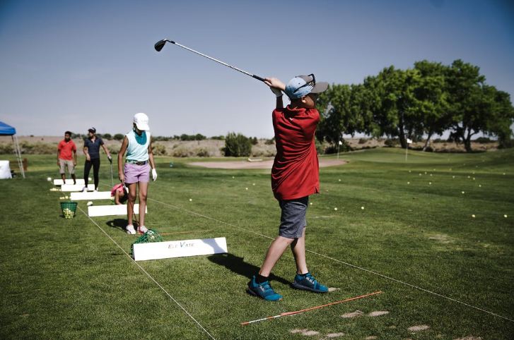 Family playing golf-