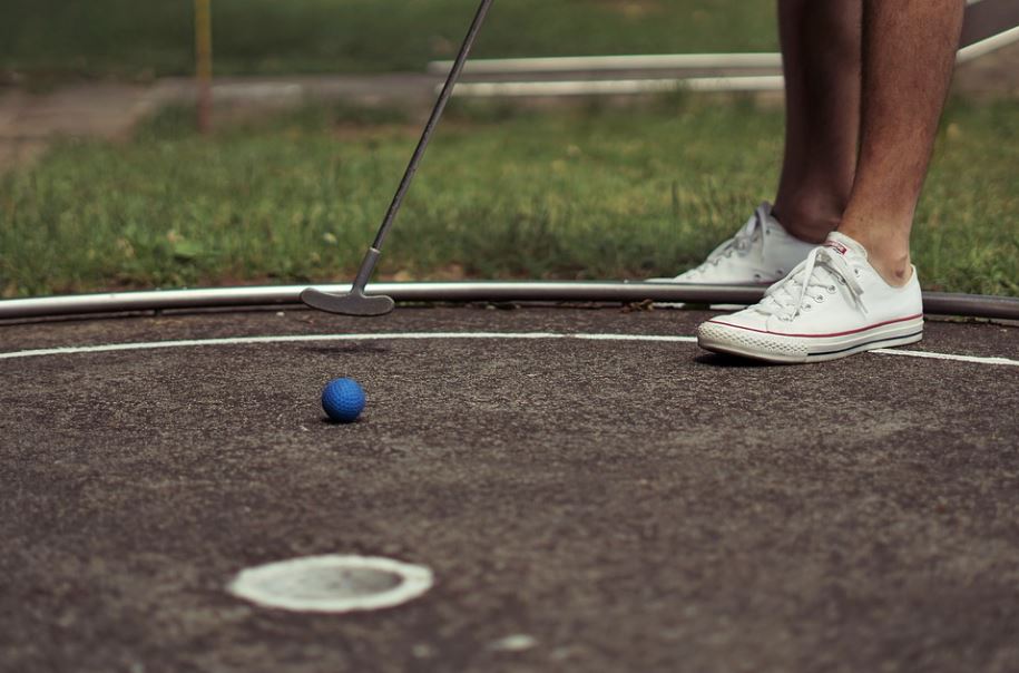 playing mini-golf