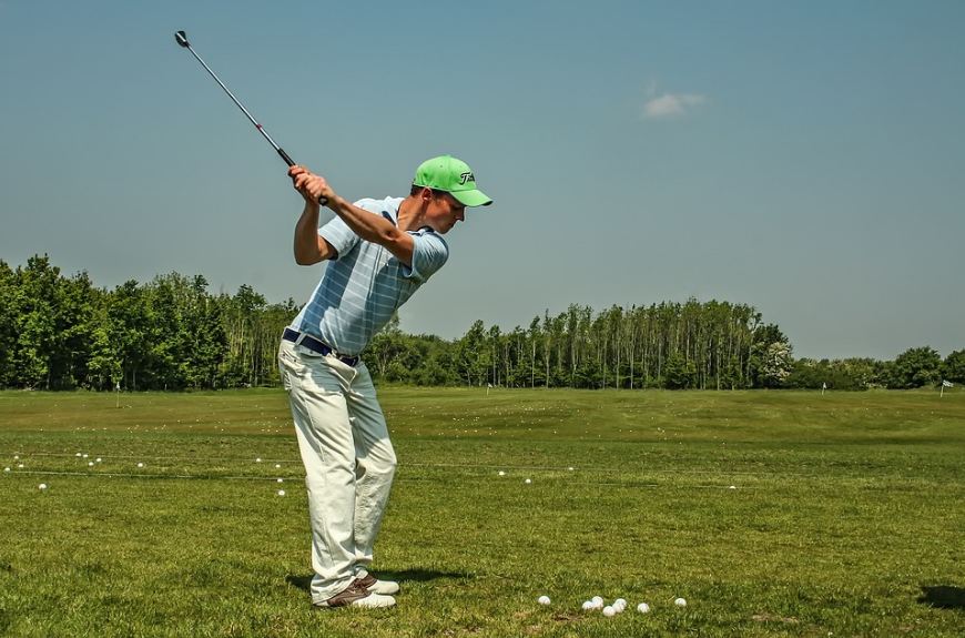 male golfer swinging a golf club