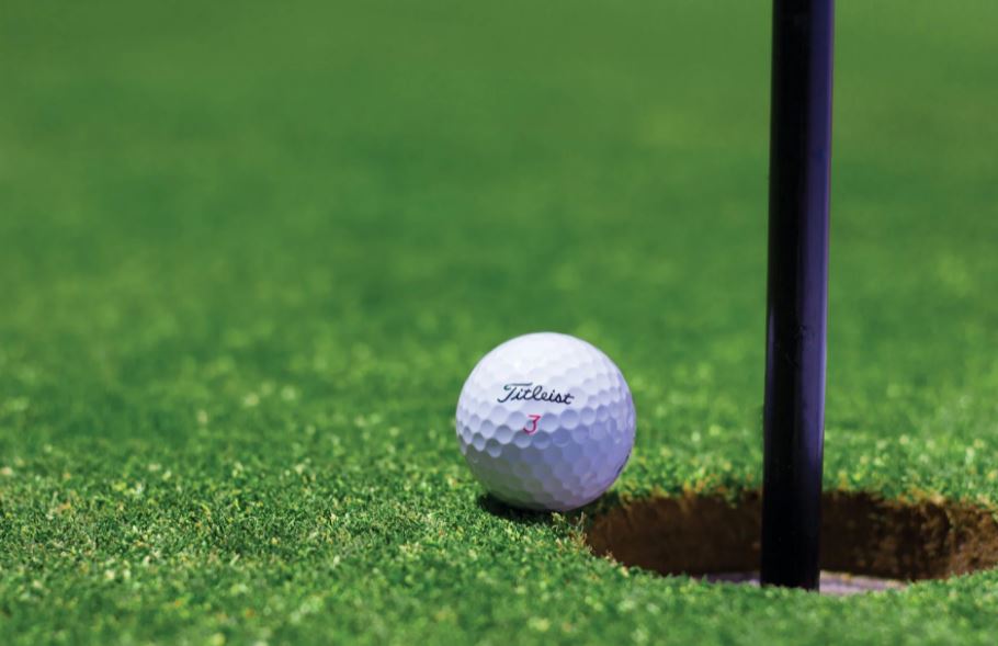 Golf ball near a hole