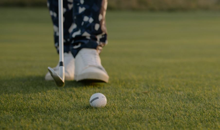 Player standing near a golf ball